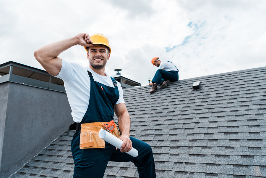 professional roofers working on roof repair